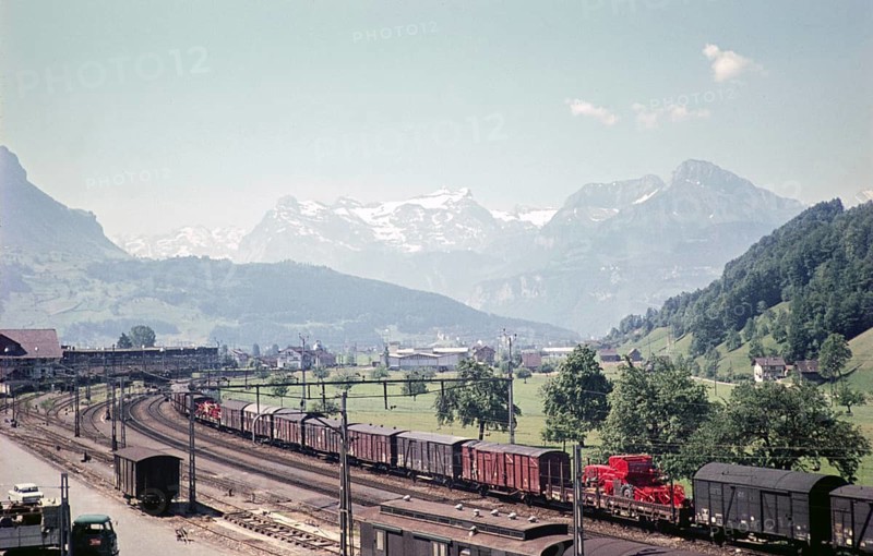 Goods train railway layout with a view of the mountains, probably Schwyz, Switzerland, Europe, 1959