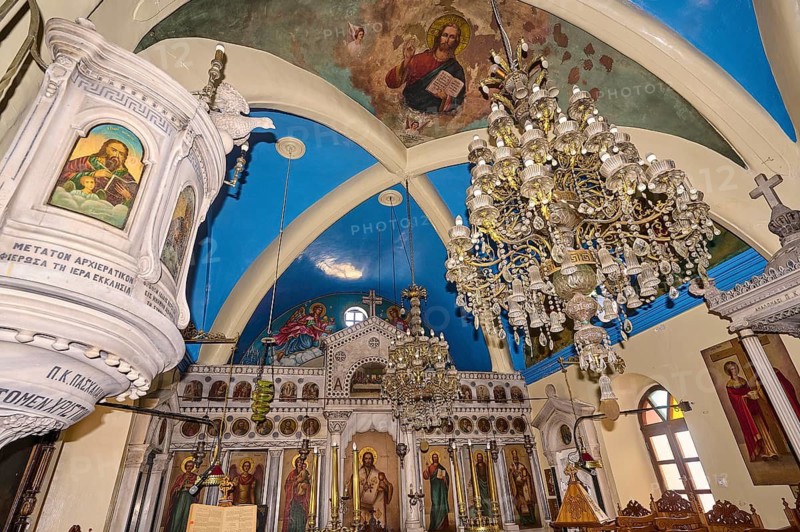 Magnificent church interior with chandelier, images of saints and painted vaulted ceiling, Platia and Church of Issodia Theotokou, Nikia, Nisyros, Dodecanese, Greek Islands, Greece