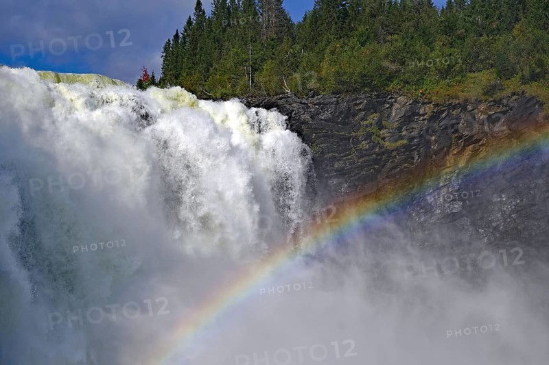 Close-up of a mighty waterfall with a shimmering rainbow, Tännforsen, Jämtland, Sweden