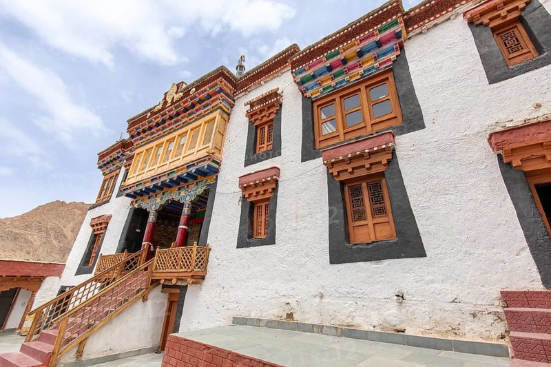 A captivating view of a traditional Buddhist monastery in Zanskar Valley, Ladakh, India. The colorful architecture and serene backdrop highlight the area cultural heritage