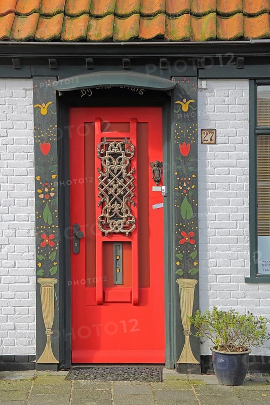 Red front door with frame, decorations and house number, painting, Den Burg, Texel, North Holland, Holland, Netherlands