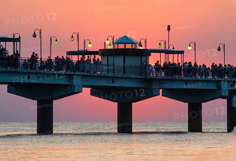 Sunset at the pier in Miedzyzdroje, Western Pomerania, Poland, East Europe