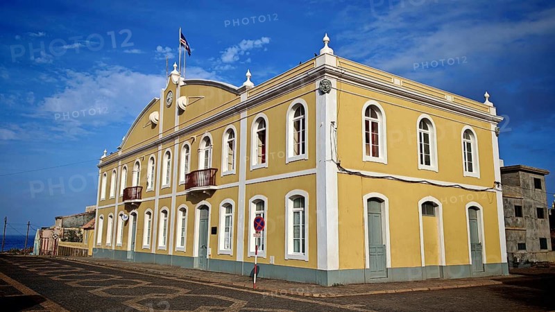Historic yellow building under blue sky with colonial architecture and Cape Verdean flag, flag, hiking, Ponta do Sol City Hall, Santo Antao, Cabo Verde, Cape Verde, Cape Verde