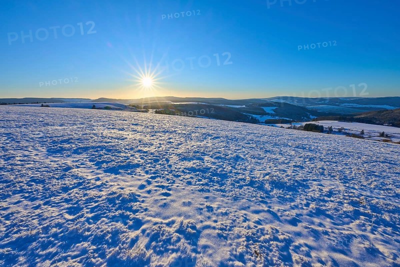 Clear sky over snowy winter landscape, sun on the horizon, winter, Wasserkuppe, Gersfeld, Rhön, Hesse, Germany