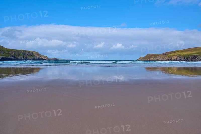 Reflective sandy beach with calm sea and slightly cloudy sky, Farr Bay, Bettyhill, Thurso, Scotland, United Kingdom, United Kingdom