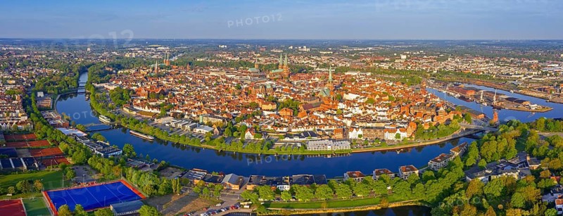 Aerial view over the river Trave and church towers in the old town of the Hanseatic City of Lübeck in spring, Schleswig-Holstein, Germany