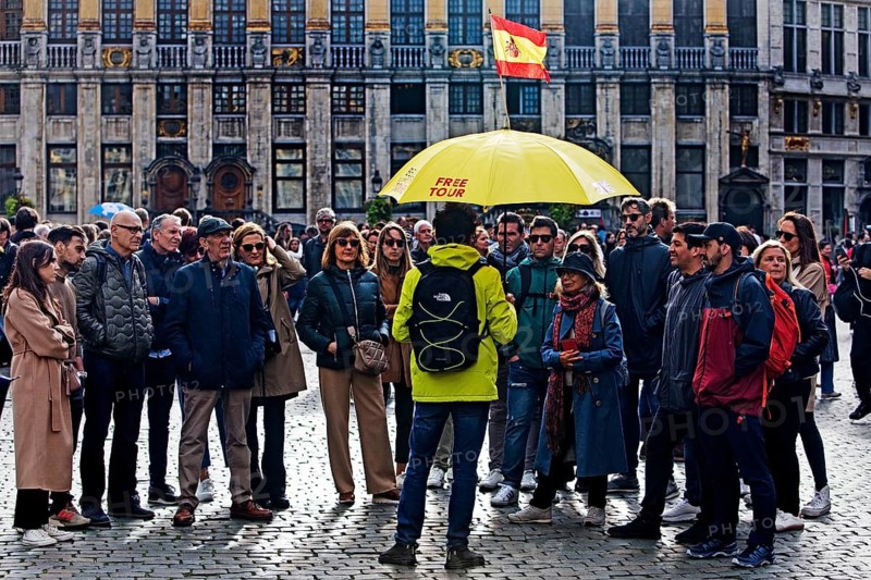 Group of people on a guided tour in one language on the Grand-Place, Grote Markt, Brussels, Belgium
