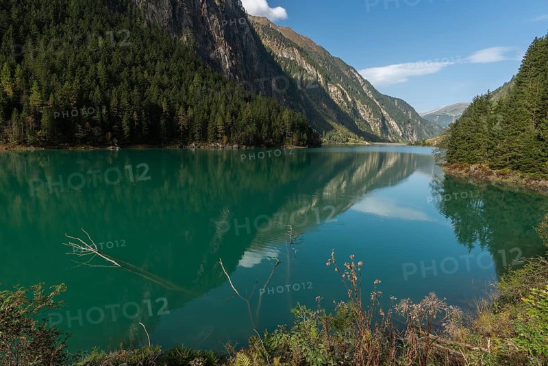 Stilluptal, Stiillup reservoir (1116m), Stillupgrund, Mayrhofen, reservoir lake, dam, water reflection, alpine mountain landscape, coniferous forest, blue sky, Zillertal Alps, Tyrol, Austria