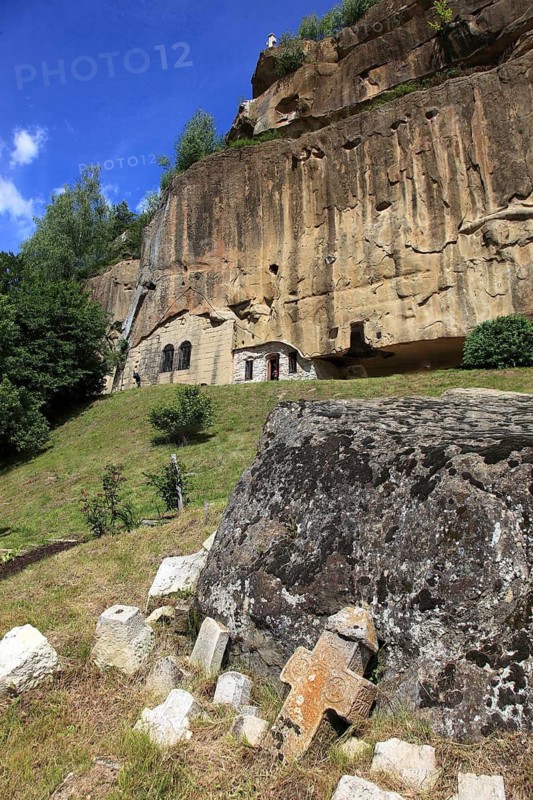 Corbii de Piatra rock monastery, stone ravens carved into a massive, 30-meter high sandstone wall, village of Jgheaburi, municipality of Corbi, in the district of Argesin, Wallachia, Romania