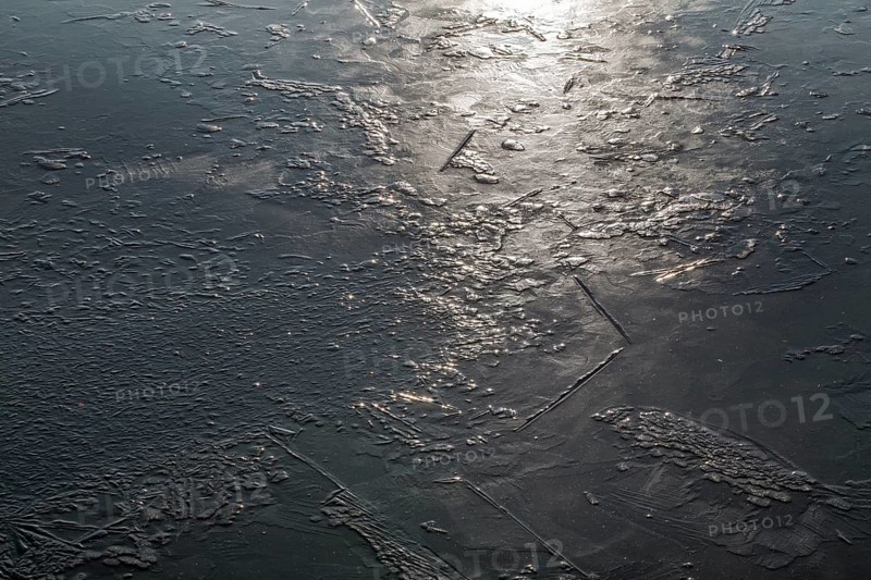 Frozen lake, structures of the water surface