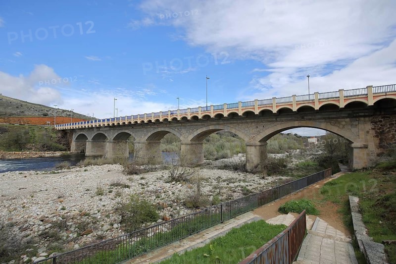 Stone arch bridge over the Rio Tormes river, riverbed, low tide, El Barco de Ávila, Sierra de Gredos, Spain