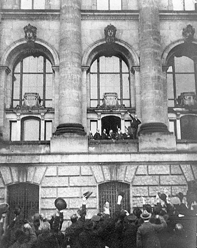 Philipp Scheidemann proclaims the Republic from the west balcony of the Reichstag in Berlin on 8 November 1918. A great moment in the democratic history of Germany. Berlin, Germany Philipp Heinrich Scheidemann (26 July 1865, Kassel - 29 November 1939, Copenhagen) was a German journalist and member of the German Social Democratic Party. He became famous when he proclaimed the republic from the west balcony of the Reichstag on 9 November 1918 after the end of the First World War and the collapse of the monarchy. It was the first democratic system in Germany and went down in history as the Weimar Republic. Like Friedrich Ebert, Philipp Scheidemann rejected both the extreme left and the right. He received many death threats. In 1922, right-wing extremists carried out an assassination attempt on him, which he narrowly escaped. Since then, he always carried a gun with him when he went for walks. Shortly after the National Socialists seized power, he had to flee. Initially to Austria, Czechos...