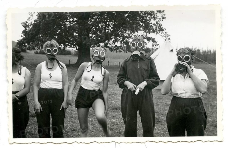 BDM woman, gas masks, exercise, NS era, National Socialism, military education, group of woman in sporting outfits with gas masks in a field, around 1936