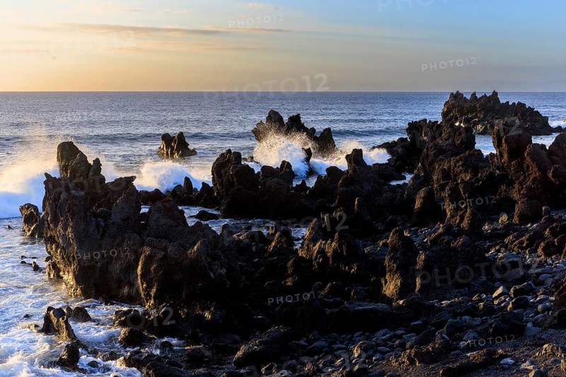 Lanzarote, Canary Islands, Spain, Europe, Los Hervideros, Dramatic coastline with rocks and waves in evening light