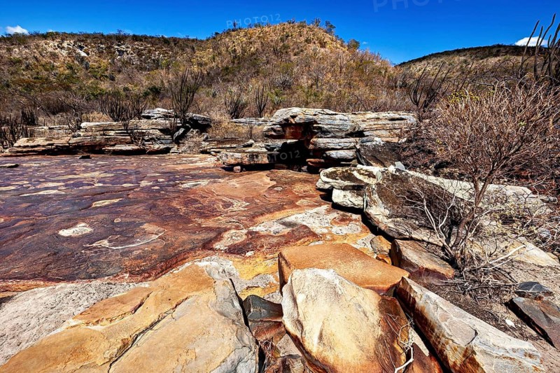 Impressive rock formations in a dry desert landscape under a clear blue sky, the thornshrub savanna in the Caatinga countryside in the federal states of Pernambuco and Bahia in Brazil