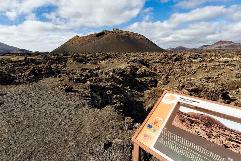 Hiking trail to the volcanic crater Caldera de Los Cuervos, information board, lava fields, Los Volcanes nature park Park, Tias, Yaiza, Lanzarote, Spain