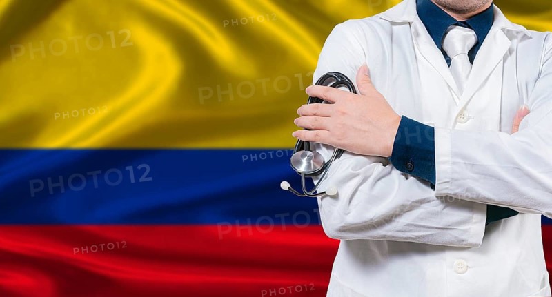 Colombian national health system, Medical professional holding sthetoscope isolated