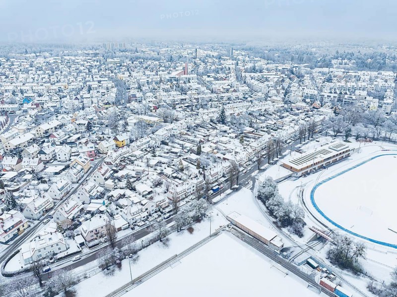Sweeping aerial view of a snow-covered city with sporting detail, Sindelfingen, Germany