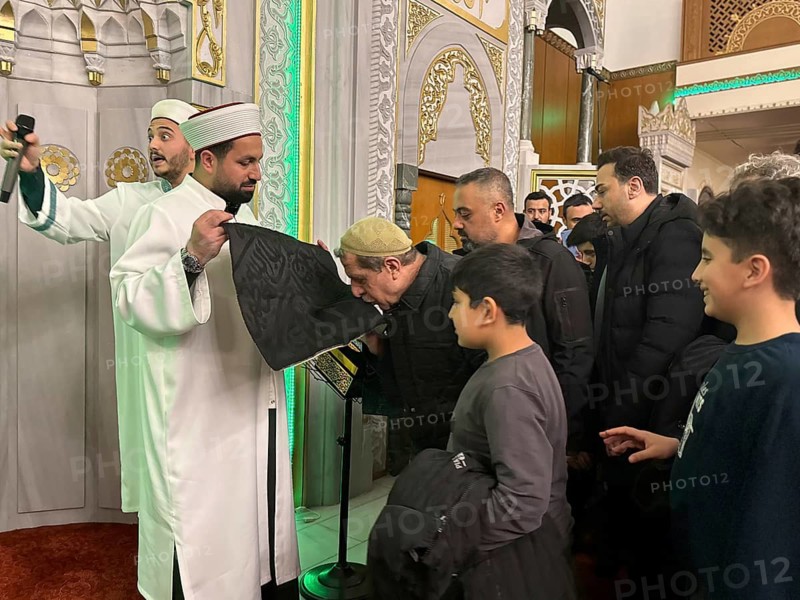 Dozens of Muslims stand in a long queue to view a sacred piece of the Kaaba curtain (Kiswa) while observing Laylat al-Qadr with prayers and supplications during the holy month of Ramadan in Gaziantep, Turkey on March 16, 2026, Gaziantep, Turkey