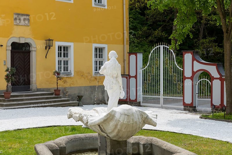 Female figure with water jugs on a shell, white fountain in front of Rauenstein Castle, Pockau-Lengefeld, Erzgebirge, Saxony, Germany