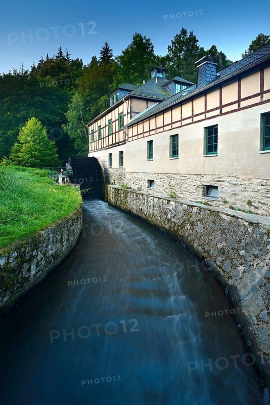 The Clodramühle, watermill with water wheel and half-timbered structure in the Elster Valley, Berga an der Elster, Thuringia, Germany