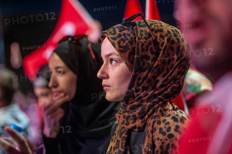 Istanbul, Turkey. 19th July 2016. A Turkish Muslim woman among the crowds that fill Taksim Square in Istanbul to celebrate the failure of attempted coup d'état against the Akp ruling government of Recep Tayyip Erdogan, Turkey