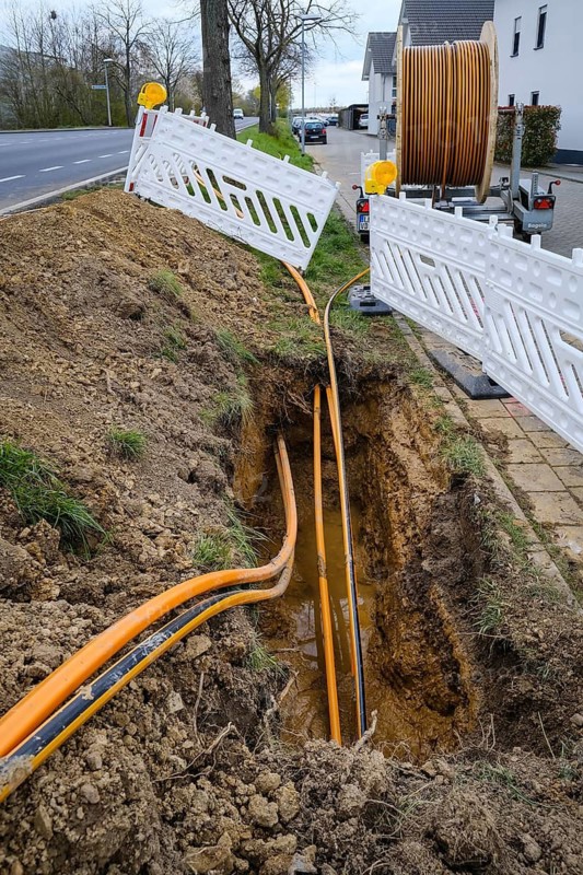 Rheinbach, North Rhine-Westphalia, Germany - Internet broadband expansion, construction site for laying fibre optic cable, cable drum with fibre optic cable, new construction of fibre optic routes on behalf of Telekom, fast Internet, DSL cable connection for households