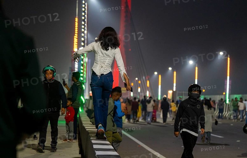 People gather on the newly inaugurated Kumar Bhaskar Varma Setu, a six-lane cable styled bridge over the Brahmaputra River, in Guwahati, India on 15 February 2026