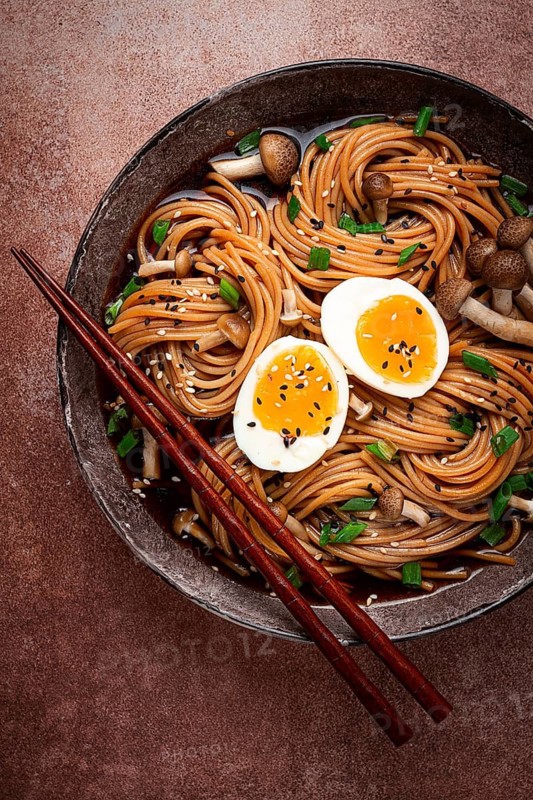 Buckwheat noodles, soba, with shimeji mushrooms, boiled egg, green onion, sesame seeds, homemade, no people