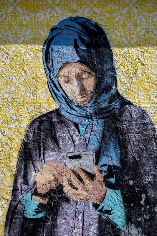 Mural of a veiled woman with a mobile phone, graffito, Al Khobar, ash-Sharqiyya province, Persian Gulf, Saudi Arabia