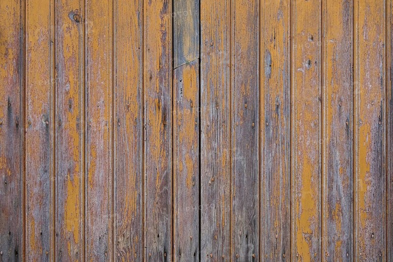 Old wooden door with peeling paint, texture, background, Apulia, Italy