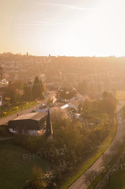Aerial view of a village in warm afternoon light with roads and trees, Deufringen, Aidlingen, Heckengäu region, Böblingen district, Germany