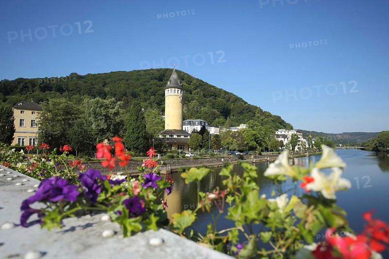 View from the Kurbrücke to the Quellenturm built in 1907, floral decoration, blooming flowers, Lahn, Bad Ems, Rhineland-Palatinate, Germany