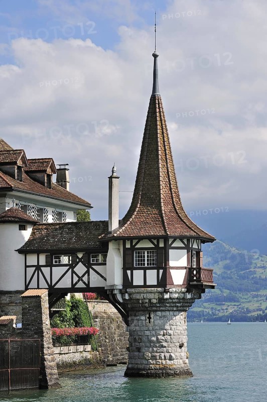 The castle of Oberhofen along the Thunersee, Lake Thun in the Bernese Alps, Switzerland