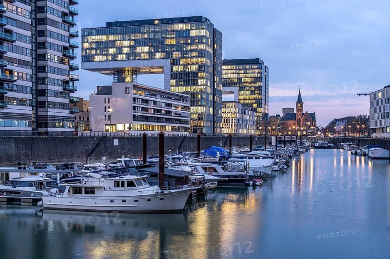 Rheinau harbour and crane houses at dusk, Cologne, North Rhine-Westphalia, Germany