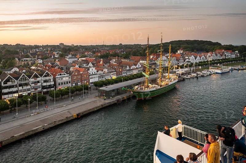 Travellers look from the Finland ferry to the barque Alexander von Humboldt II and the old town of the Baltic Sea spa Travemünde, Bay of Lübeck, Lübeck, Schleswig-Holstein, Germany