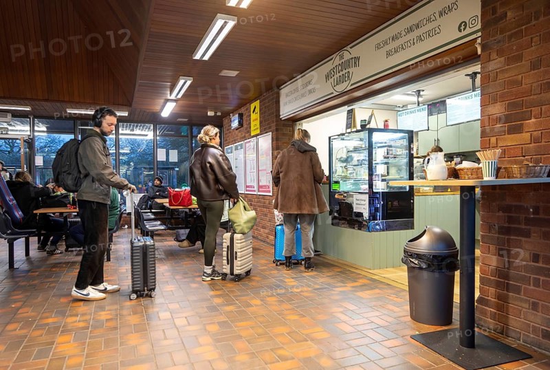 Passengers queuing at The Westcountry Larder Coffee takeaway shop shop, Tiverton Parkway railway station, Somerset, England, UK