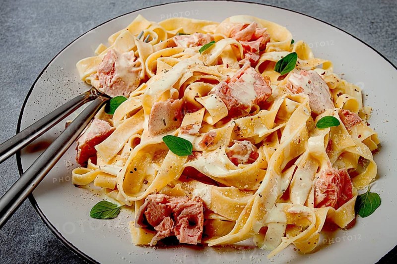 Tagliatelle pasta, in cream sauce with salmon, homemade, no people