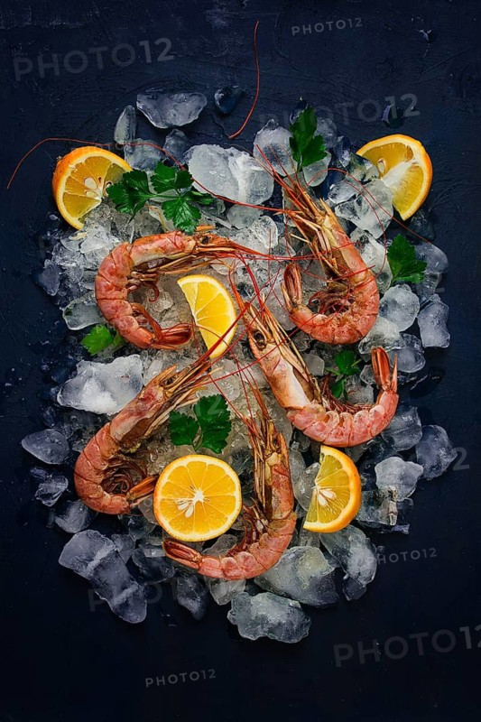 Tiger prawns, boiled and frozen, on ice, top view, close-up, no people