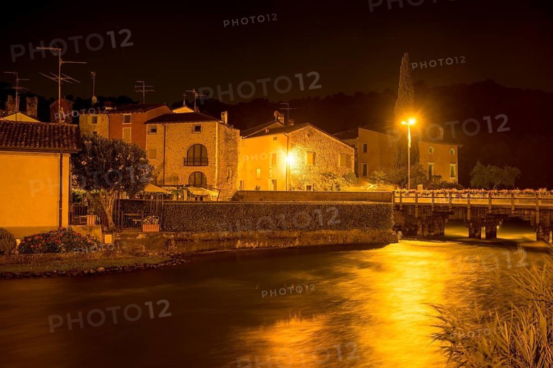 Night shot Mincio river and town, Borghetto, Valeggio sul Mincio, Province of Verona, Italy