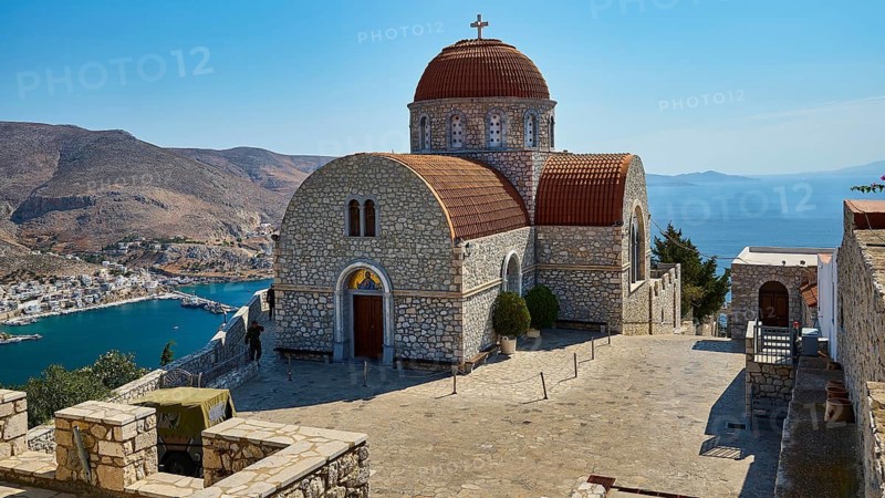 Agiou Sarvas monastery, Agion Pandon church, stone church with dome on a hill overlooking sea and mountains, Pothia, main town, port, Kalymnos, Sponge Diving Island, Dodecanese, Greek Islands, Greece
