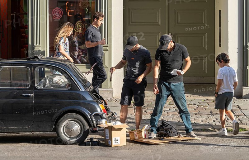 Two men repair the engine of a Fiat 500, Neue Schönholzer Strasse, Berlin, Germany