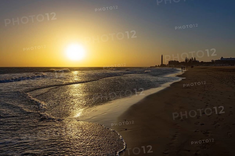 Sunset at the beach of Maspalomas with lighthouse Faro de Maspalomas, Gran Canaria, Canary Islands, Spain, Atlantic Ocean