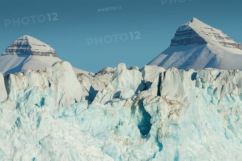 Glacier front and two of the three mountains: Tee Kroner (Three Crowns), Kronebreen or Kronengletscher Glacier, Kongsfjord or Kongsfjorden, the Svalbard archipelago, Svalbard, Norway