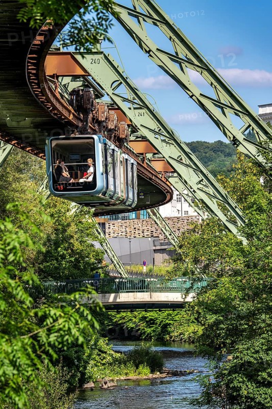 The Wuppertal suspension railway runs above along the Wupper River, between the central railway station stop and Ohligsmühle, Germany