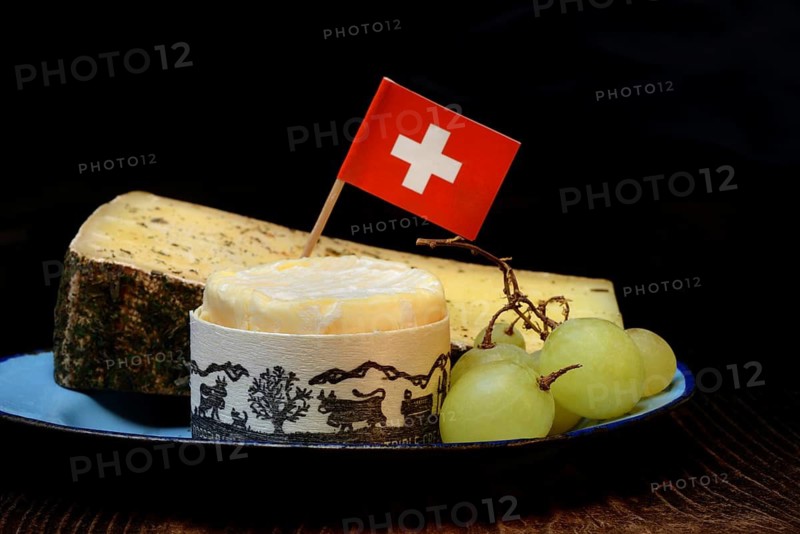 Plate of Swiss cheese, Gstaad mountain cheese with herbs and cream cheese 'Fette Berta', Switzerland