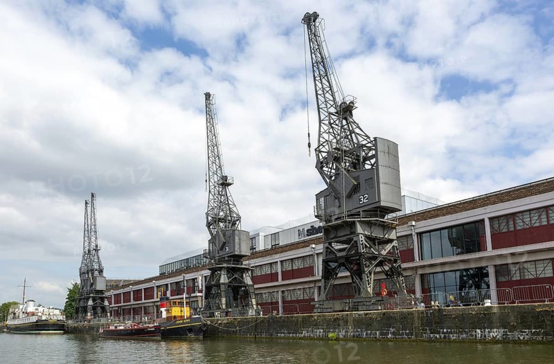 Stothert and Pitt 1950s electric cargo cranes on quayside of Floating harbour, M Shed museum, Bristol, England, UK