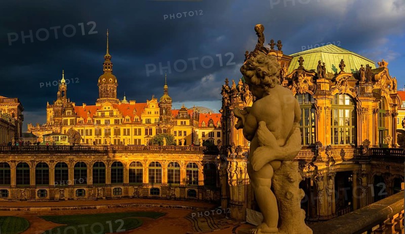 Glockenspiel pavilion of the Zwinger and Residenzschloss in the evening light in front of a dark rainy sky, Dresden, Germany