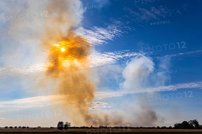 A large forest fire covering an area of 200 hectares is currently raging in the Gohrischheide between Brandenburg and Saxony. As the former military area is contaminated with ammunition, it is difficult to extinguish the fire and some small neighbourhoods near the fire had to be evacuated, Wülknitz, Saxony, Germany