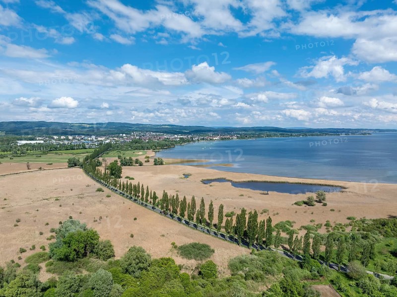 Aerial view of Mooser Damm with state road L192 which crosses Radolfzeller Aachried on the shore zone of western Lake Constance and connects the town of Radolfzell with the village of moss and the Mettnau peninsula, Konstanz district, Baden-Württemberg, Germany